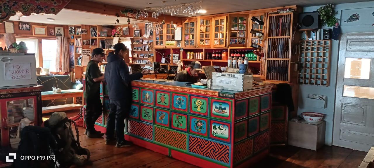 The dining room and hand-painted bar at the heart of the lodge